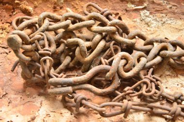 old rusty iron chain on the ground