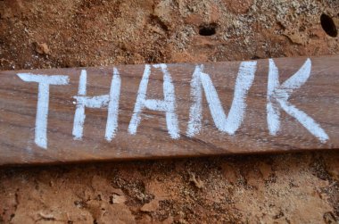 thank you written with a white sign