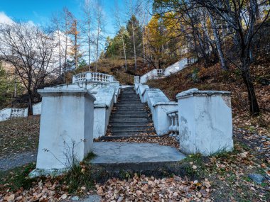 Stalinist architecture. An old concrete staircase on the territory of the resort of Arshan in Buryatia, Eastern Sayans. clipart