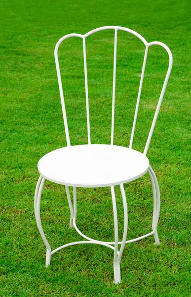 White chair on nature green field grass — Stock Photo, Image