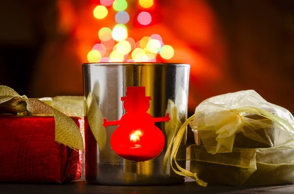 Christmas decorations candle in jar and gift box — Stock Photo, Image