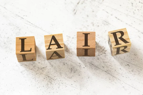 Cuatro Cubos Madera Con Letras Lair Significa Escuchar Reconocimiento Identificar —  Fotos de Stock