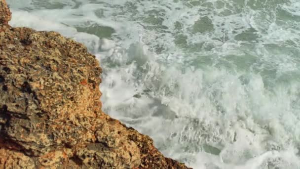 Small Waves Crashing Rocky Shore Sunny Day Slow Motion Video — Stock Video