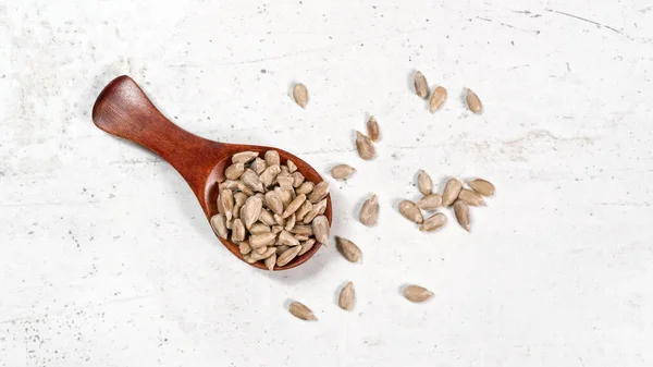 Peeled Sunflower Seeds Small Wooden Scoop Placed White Stone Board — Stock Photo, Image