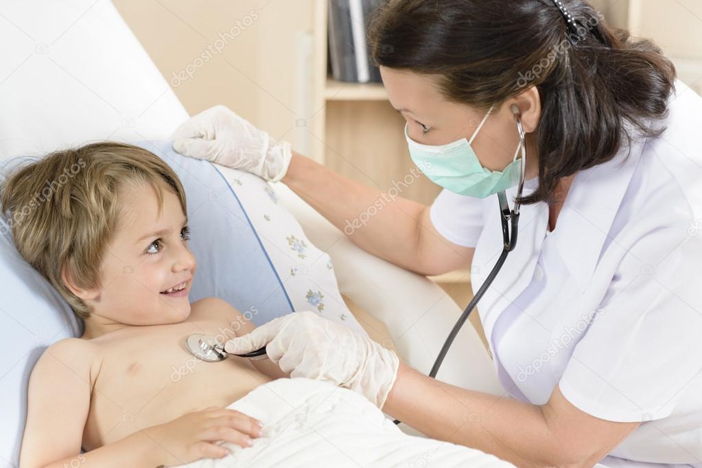 Doctor consulting a little boy