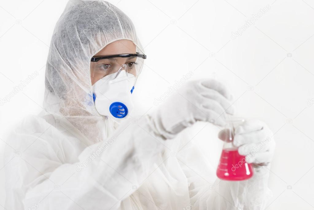 Young Woman wearing protective suit holding some laboratory glassware