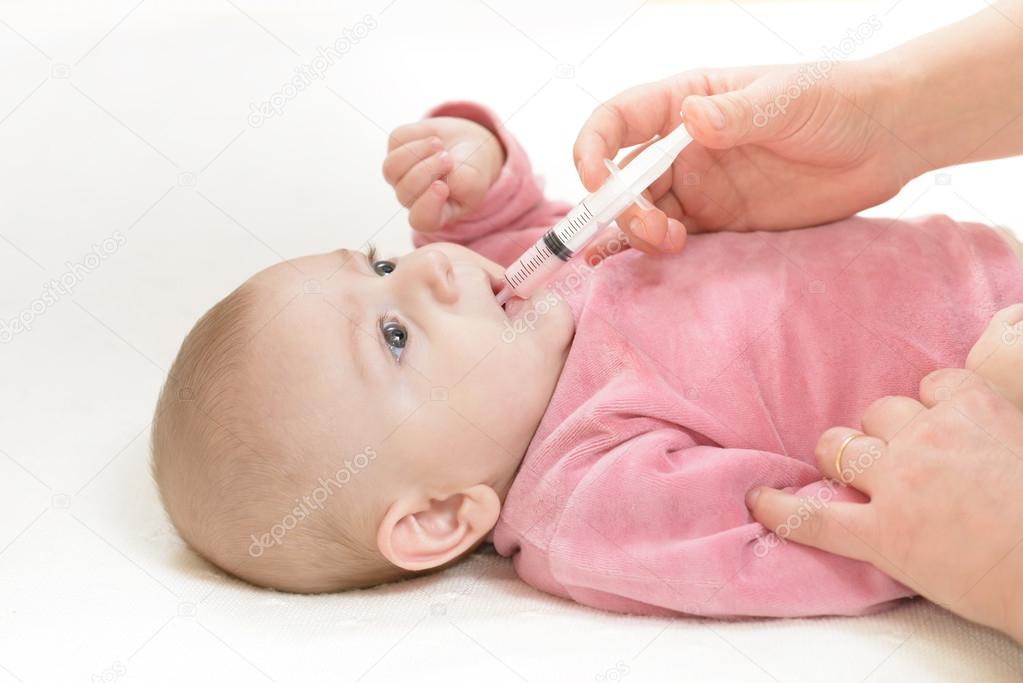 Newborn baby gets medicine