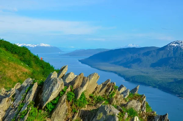 Alaska landscape mountains and water, aerial perspective view. Mountains reflection in the water. Remote location, unplugged. Wild beauty in nature. Untouched environment.