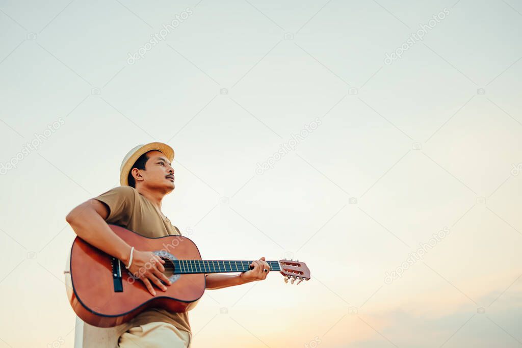 A man playing guitar