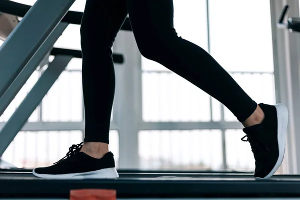 Fitness women running on track treadmill, exercise fitness. Fitness, gym, workout and lifestyle concept.