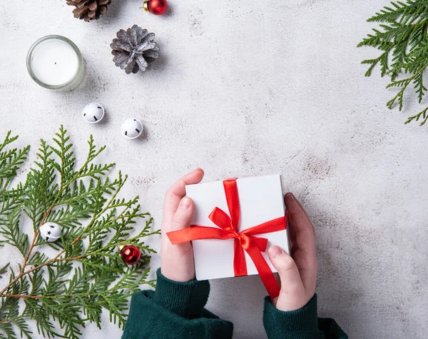 Girls Holding White Christmas Present Red Ribbon Light Gray Table — Stock Photo, Image