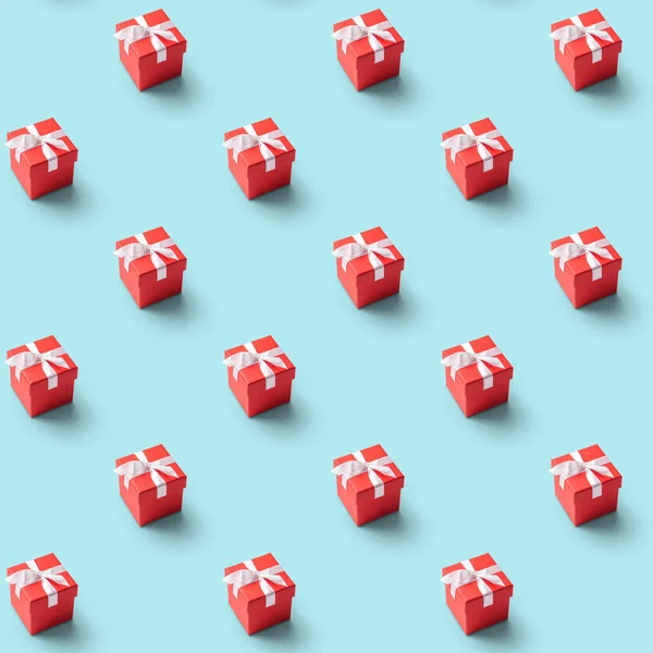 seamless pattern of red present box with white ribbon on  blue background. Concept and celebration photo