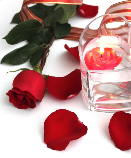Beautiful red rose and red candle — Stock Photo, Image