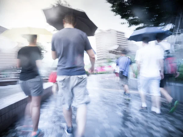 People walking in the street on a rainy day. — Stock Photo, Image