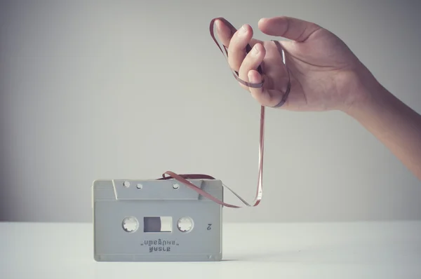 Hand over messy tape — Stock Photo, Image