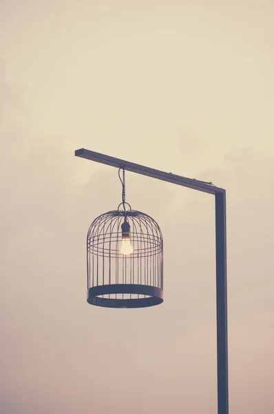 Bird cage decorated as outdoor light post. — Stock Photo, Image