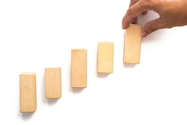 Hand aranging wood block stacking as step stair. — Stock Photo, Image