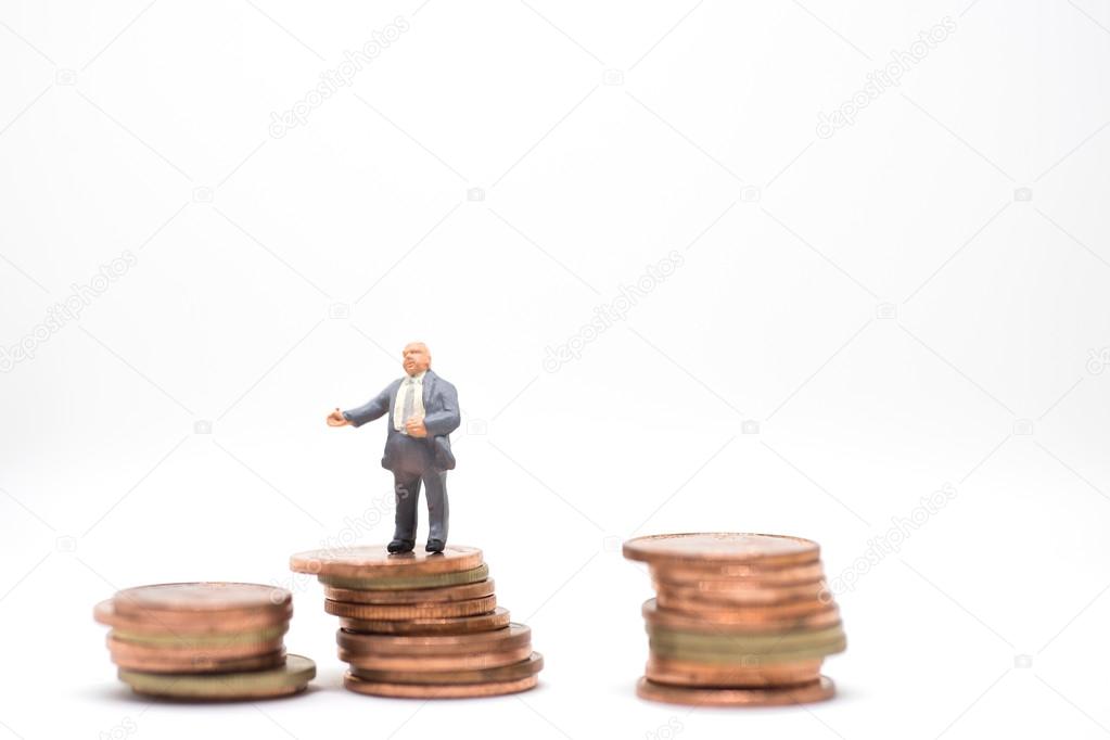 Businessman standing on coin