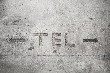 Telecommunication sign on cement floor clipart