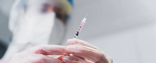 COVID 19 coronavirus vaccine. Doctor prepared to vaccinate the patient against Covid.