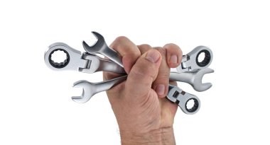 Çeşitli ingiliz anahtarlarını sıkıca kavrayan insanlar mekanik görevler ve tamirat için ideal aletleri sergiliyorlar. Araçlar, ayrıntıları ve işlevselliklerini vurgulayan beyaz arkaplan aleyhinde sunuluyor