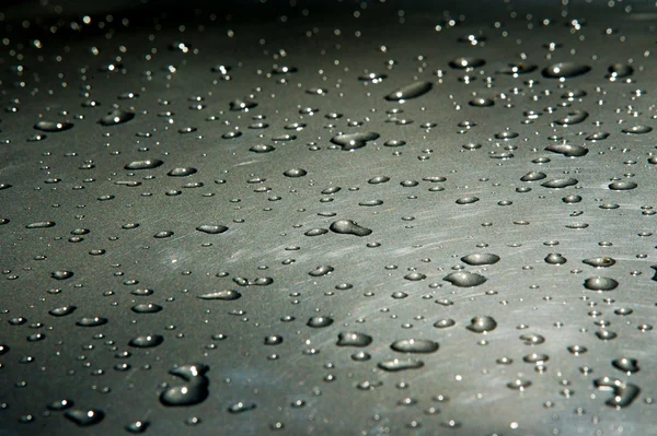 Textur Hintergrund. Regentropfen auf dem Lack. Niederschlag in der — Stockfoto