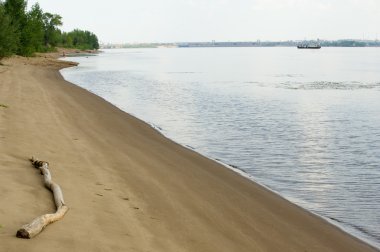 Doku, arka plan. kum plaj. gevşek taneli madde, soluk sarımsı kahverengi, silisli ve diğer kayalar erozyon kaynaklanan ve plajları büyük bir kurucu şekillendirme,