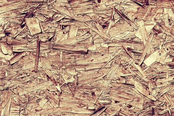 Vintage processing. Texture, background. Fiberboard. stiff board made of compressed and treated wood pulp. old.