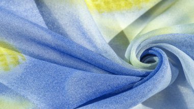 Yumuşak mavi, soyut desenleri ve yatak tonları olan ipek kumaş, sarı ve beyaz tonlarda. Doku, desen, koleksiyon