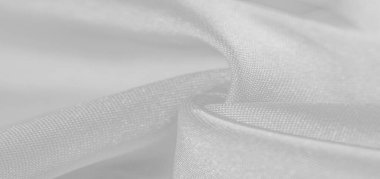 İpek beyazdır. Beyaz gri saten doku, gümüş kumaş, ipek panorama, arka plan, güzel yumuşak bulanık desenli. Doku, arkaplan deseni