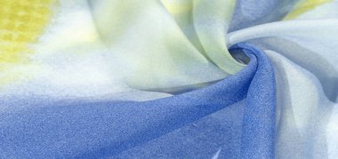 Yumuşak mavi, soyut desenleri ve yatak tonları olan ipek kumaş, sarı ve beyaz tonlarda. Doku, desen, koleksiyon