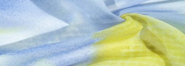 Yumuşak mavi, soyut desenleri ve yatak tonları olan ipek kumaş, sarı ve beyaz tonlarda. Doku, desen, koleksiyon