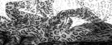 İpek kumaştan siyah beyaz leopar desenli. Leopar desenli hafif ipek senin tasarımına mükemmel uyacak, şık görünüyor ve kaba değil! Doku, arkaplan, desen