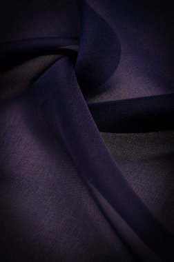 Şeffaf lacivert şifon, ipek, hava kuvvetleri mavi soyut arka plan. Yeşil kumaş yaklaş. - Yumuşak şeffaf bir kumaş ve pürüzlü bir kumaş (matte, crepe) çünkü bükülmüş iplik kullanımı