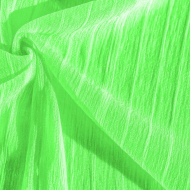 İpek kumaş. Yeşil kırışık kumaş dokusu. Yeşil buruşuk, dalgalı yüzey dokusu. Yakın çekim, yumuşak odaklanma. arkaplan, kalıp