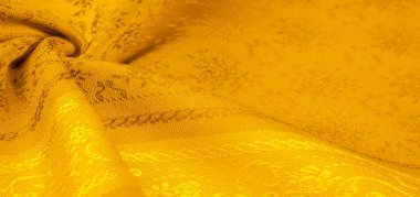 Sarı kumaş. Kehribar turuncu. Soyut doku. Kumaş liflerinden yapılmış renkli yüzey. Doku, arkaplan, desen