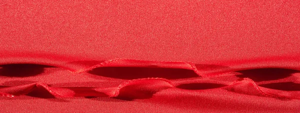 Red silk. As an abstract background, you can use the texture of luxurious red silk or satin. colorful texture, background, pattern