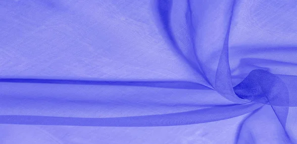 Blue silk fabric texture. Smooth, elegant blue silk or satin texture. luxurious fabric. can be used as an abstract background.