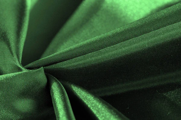 emerald green silk fabric, metallic fabric shades, shiny green metallic background for decorative design, decor element, wallpaper. texture pattern