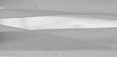 doku arkaplan deseni. İnce bir mat parıltısı olan beyaz ipek kumaş. Dizaynınız, aksanınız, duvar kağıtlarınız, posterleriniz ve kartpostallarınız için mükemmel..