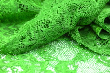 Yeşil dantel. Elastik moda tekstil jakuzi danteli. Seksi iç çamaşırları için dekoratif bir şey. Lastik bantlar. Ev dekoru. Tasarımın için doku. Geçmişi. şablon.