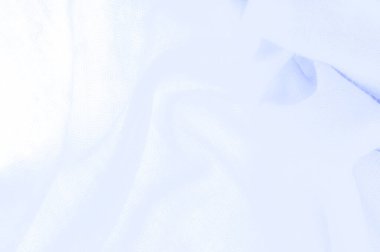 Mavi kumaş, lüks kumaşın soyut arkaplanı ya da dalgaların sıvı ipek dokusu ya da dalgalı kıvrımlar. arka plan ya da zarif duvar kağıdı tasarımı. Pamuk dokusu, doğal kumaş ve boya, parlak mavi renk.