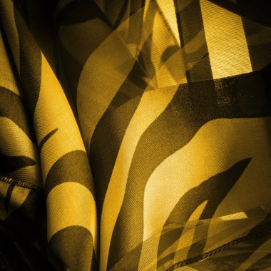 Doku. Şablon. Görüntü. Soyut sarı ipekten kumaşlar. İpek dokusu, soyutlama, tasarım ve duvar kağıdı için lüks saten.,