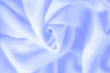 Mavi kumaş, lüks kumaşın soyut arkaplanı ya da dalgaların sıvı ipek dokusu ya da dalgalı kıvrımlar. arka plan ya da zarif duvar kağıdı tasarımı. Pamuk dokusu, doğal kumaş ve boya, parlak mavi renk.