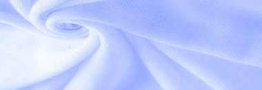 Mavi kumaş, lüks kumaşın soyut arkaplanı ya da dalgaların sıvı ipek dokusu ya da dalgalı kıvrımlar. arka plan ya da zarif duvar kağıdı tasarımı. Pamuk dokusu, doğal kumaş ve boya, parlak mavi renk.