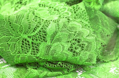 Yeşil dantel. Elastik moda tekstil jakuzi danteli. Seksi iç çamaşırları için dekoratif bir şey. Lastik bantlar. Ev dekoru. Tasarımın için doku. Geçmişi. şablon.