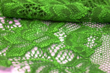 Yeşil dantel. Elastik moda tekstil jakuzi danteli. Seksi iç çamaşırları için dekoratif bir şey. Lastik bantlar. Ev dekoru. Tasarımın için doku. Geçmişi. şablon.