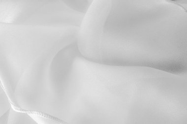 Doku. Geçmişi. Şablon. Beyaz ipek katlanmış kumaş arka plan, afiş veya kapak tasarımı. Poster için lüks tekstil dekorasyonu, yumuşak dalgalı dalgalı beyaz kumaş, poster