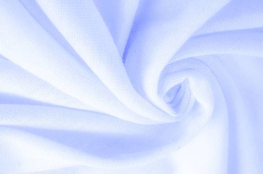 Mavi kumaş, lüks kumaşın soyut arkaplanı ya da dalgaların sıvı ipek dokusu ya da dalgalı kıvrımlar. arka plan ya da zarif duvar kağıdı tasarımı. Pamuk dokusu, doğal kumaş ve boya, parlak mavi renk.
