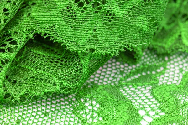 Green lace. Elastic fashionable textile jacquard lace. Decorative item for sexy lingerie. elastic tapes. Home decor. Texture for your design. background. template.